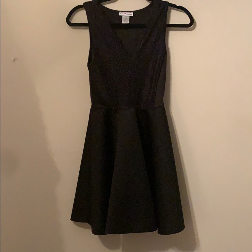 Black cocktail dress. Lace at the top.